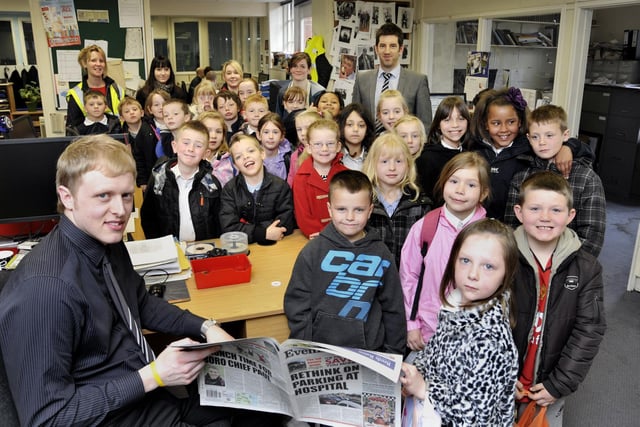 Scarborough Evening News reporter Steve Hugill, left, and digital editor Adam Meads, back right, show a group of children from Hinderwell Primary School, around the Evening News newsroom.