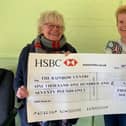 Presentation of cheque from Thorpe & Co to The Rainbow Centre.