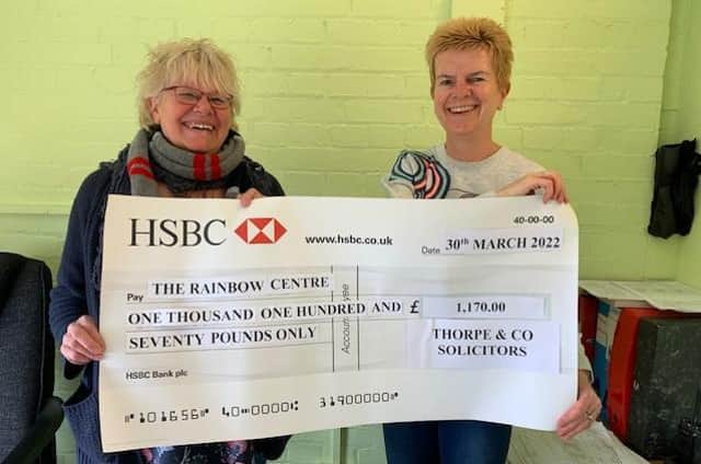 Presentation of cheque from Thorpe & Co to The Rainbow Centre.