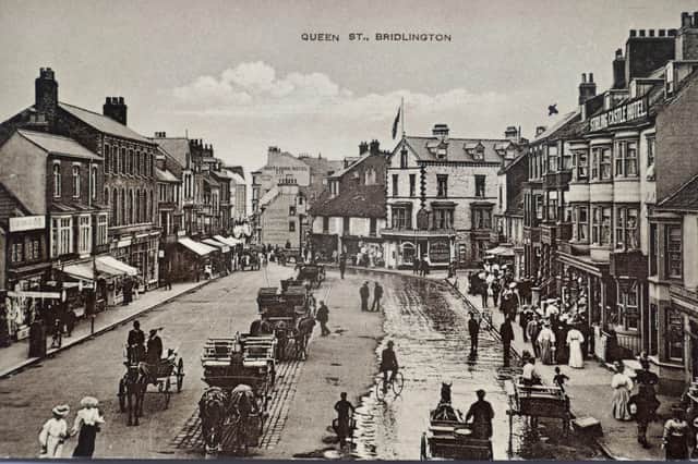 This excellent sepia postcard from 1902 shows Queen Street complete with horse-drawn carriages.