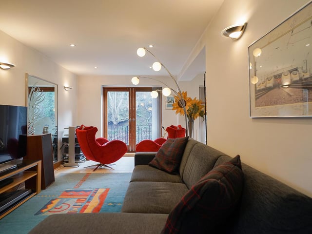 Double doors take you out to a balcony, from the L-shaped lounge.