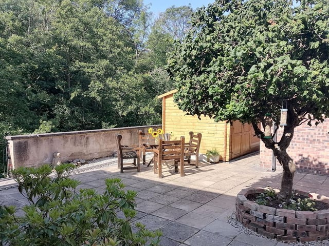 Trees and greenery provide a lovely backdrop to the property.