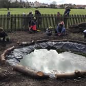 Children build a pond and plant trees at Our Lady and St Peter’s Catholic Primary School in Bridlington. Photo submitted