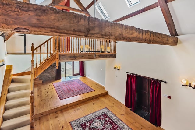An impressive staircase branches out to two first floor galleried landings, from which can be found four bedrooms, three of which are doubles.