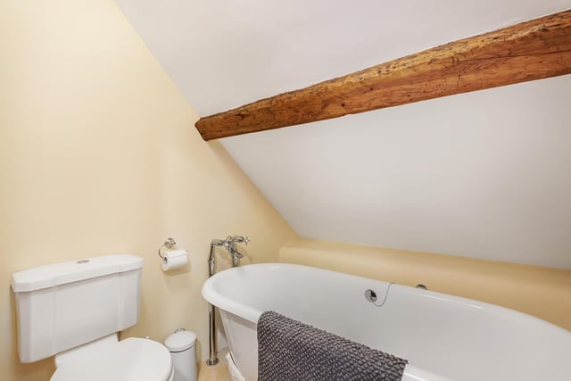 There’s a bathroom with a cast iron, free-standing bath tub with claw feet, and another with a shower cubicle containing a power shower facility.