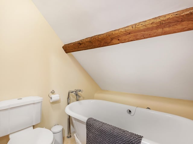 There’s a bathroom with a cast iron, free-standing bath tub with claw feet, and another with a shower cubicle containing a power shower facility.