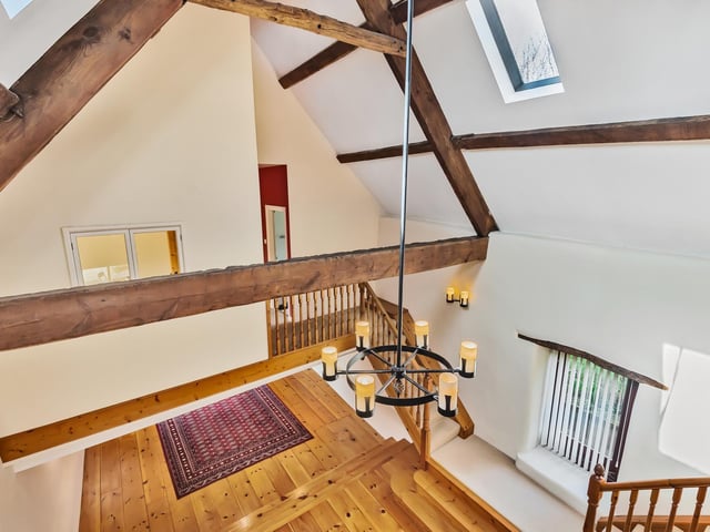 Looking down from upper to lower floor within the conversion.