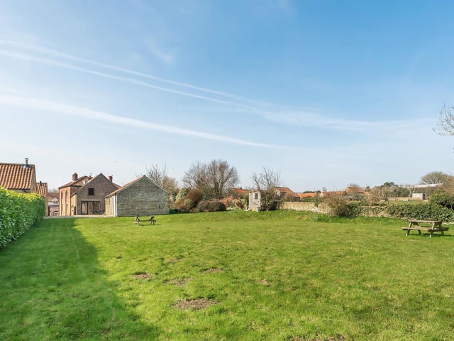 The large parcel of lawned land attached to the barn conversion.