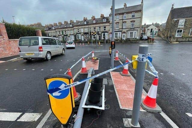 The damage caused to the new Crown Tavern traffic lights are a car crashed into them.