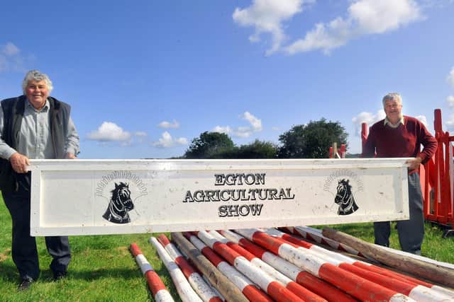 Ben Hutchinson (left), President of Egton Show in 2019, getting one of the show jumps ready with committee member Dave Flintoft.