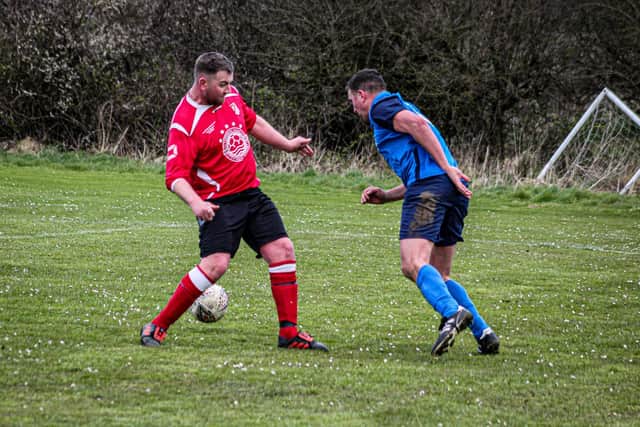 Edgehill Reserves' two-goal hero Andy Noon, right, takes on Filey Town Reserves' Grant Hayden
Photo by Alec Coulson