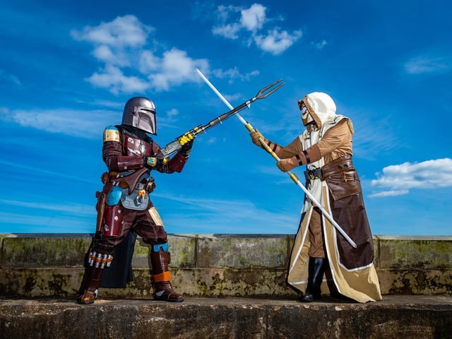 Wilson Whitley and his wife Tammy dress up as a Mandolarian and a Jedi Guardian.