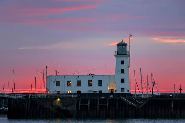 Vermilion sunrise at Scarborough lighthouse, captured by Bevereley Senturk.