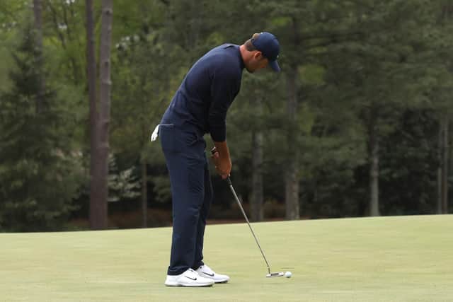 Scottie Scheffler putts on the 14th green during the second round of The Masters at Augusta National Golf Club on April 8 (Photo by Gregory Shamus/Getty Images)