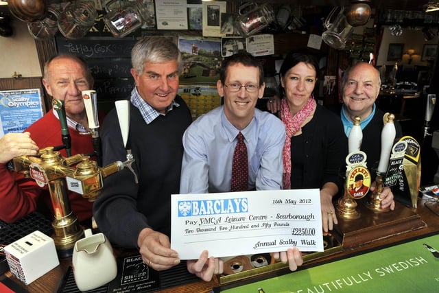 Handing over a cheque from Scalby Walk to Scarborough YMCA in 2012. From left, Jim Sloane, of Scalby Fair commitee, Alan Bruce, retiring organiser of the walk committee, Steve Marsh, executive director of the YMCA, Victoria Wilkinson, landlady of the Nag's Head pub, the walk's base, and Bob Gibbon, of the walk committee.
