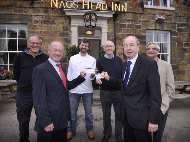 Presentation of 2014's cheques for £650 to Scalby CC and Scalby FC from Scalby Walk. From left; Roger Tiffin, Jim Sloan, Ian Hallyburton of the Nags Head, Pete Afford of Scalby FC, Phil Perry of Scalby FC and Scalby CC and Ron Shield of Scalby FC