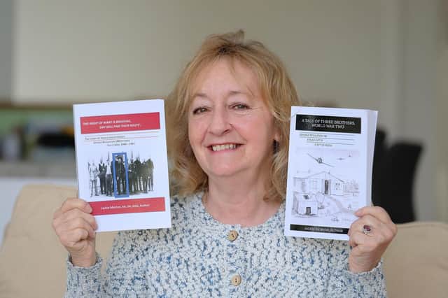 Jackie Morton with her two books - The first – The Night of Want is Breaking, Day Will Find Their Route and A Tale of Three Brothers