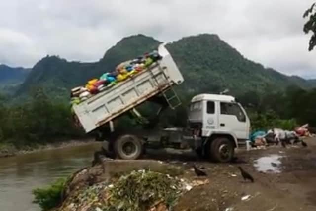 Tipping rubbish into the Amazon river