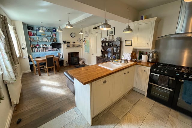 The kitchen, that has access to the garden, flows through to dining and family space.