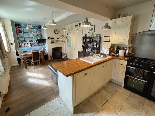 The kitchen, that has access to the garden, flows through to dining and family space.