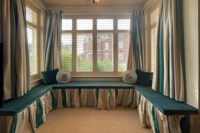 A lovely large box bay window with seating provides extra light, space and character.