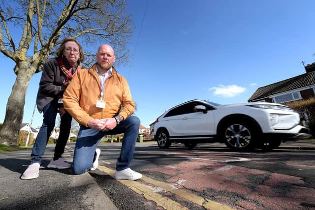 Borough councillors Eileen Murphy and Neil Heritage. "There are potholes on top of potholes [that have been previously filled in]," said Cllr Heritage.
