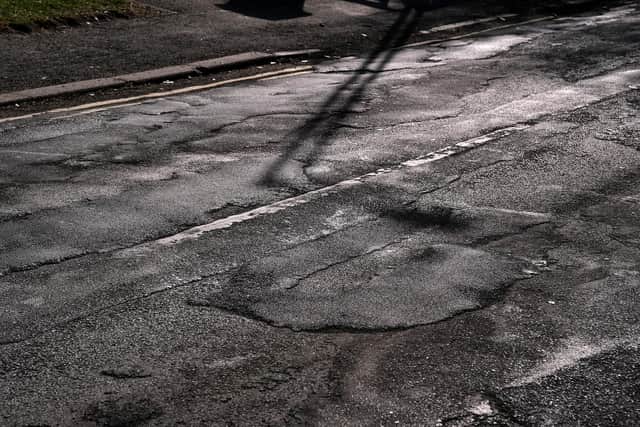 An example of the patchwork pothole repair on Green Lane, which has left an uneven surface.