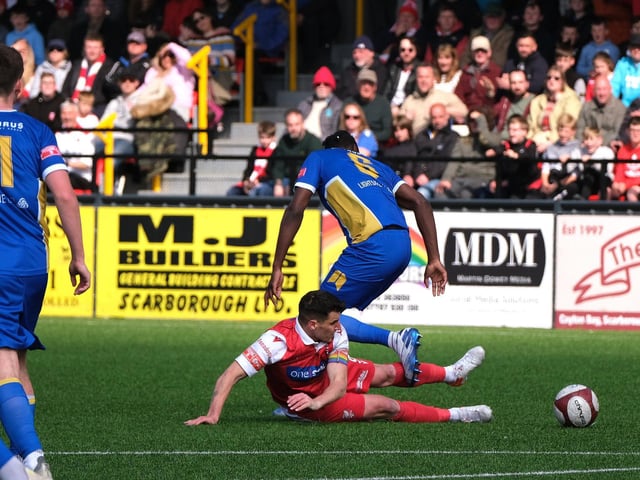 Scarborough Athletic's two-goal hero Michael Coulson hits the ground in the defeat of Radcliffe