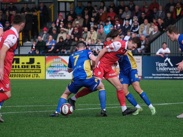 Boro's Luca Colville looks to get past the Radcliffe players