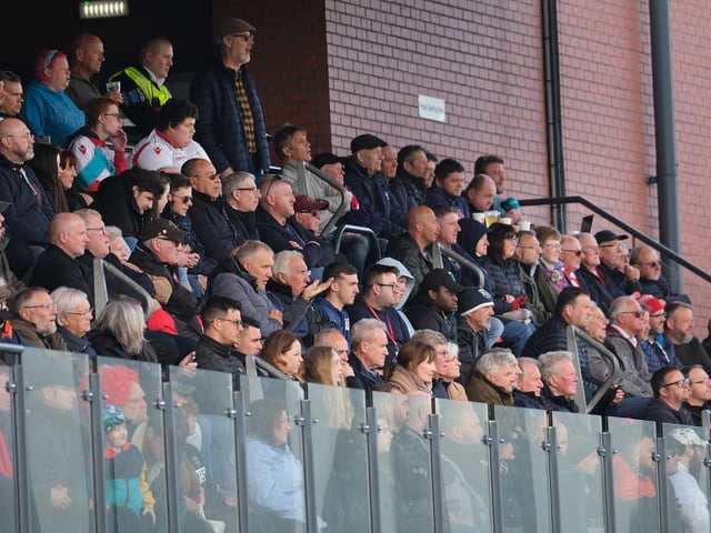 The fans watch the game