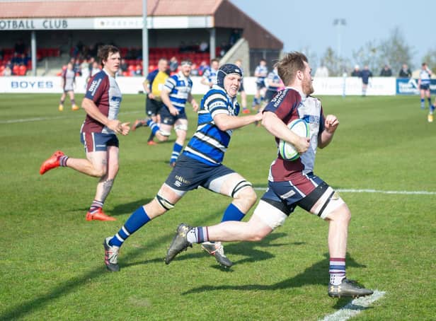 Drew Govier on his way to scoring a try