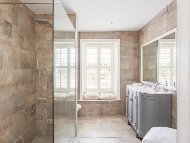 A newly refitted bathroom with walk-in shower.