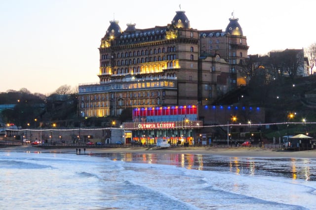 Early evening lights sparkle at The Grand Hotel and seafront.
