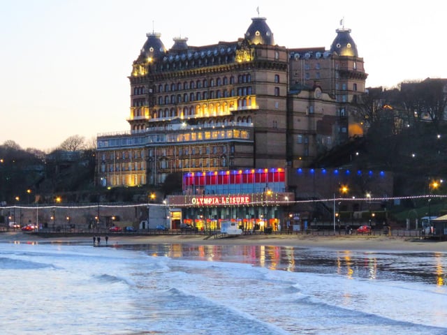 Early evening lights sparkle at The Grand Hotel and seafront.