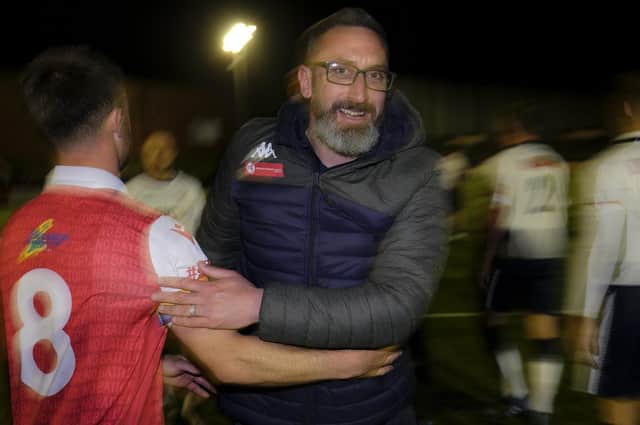 Scarborough boss Jonathan Greening and midfielder Ryan Watson celebrate the play-off semi-final win against Matlock on Tuesday night