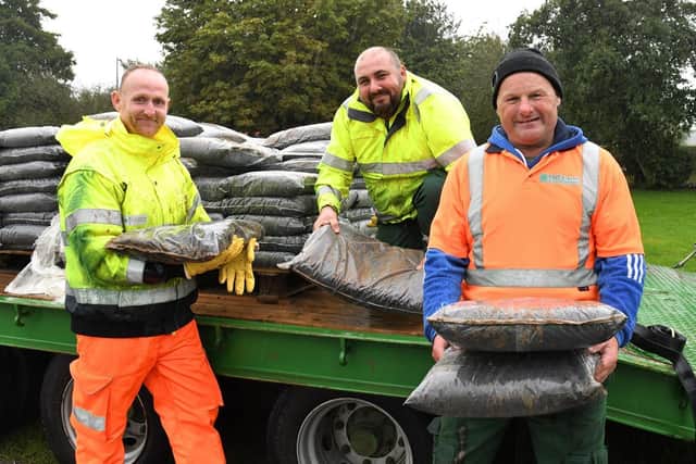 Council staff get ready to hand out the compost at last year’s giveaway event.