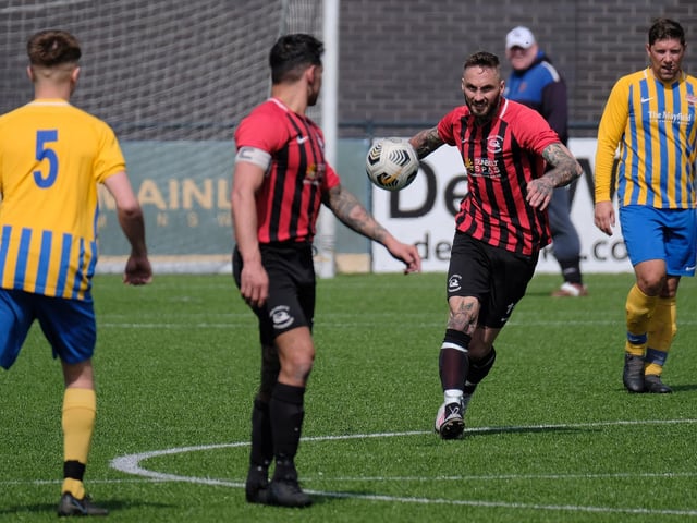 Martin Cooper looks to get on the ball for Pier