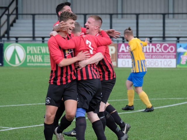 The Pier players congratulate super-sub Paul Provins on his late winner