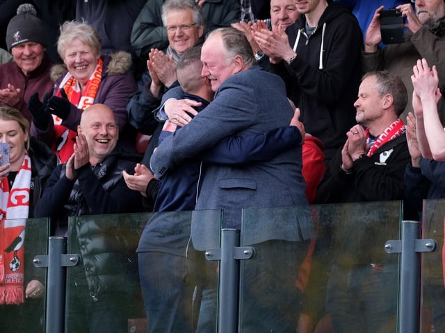 Boro chairman Trevor Bull hugs Boro boss Jonathan Greening