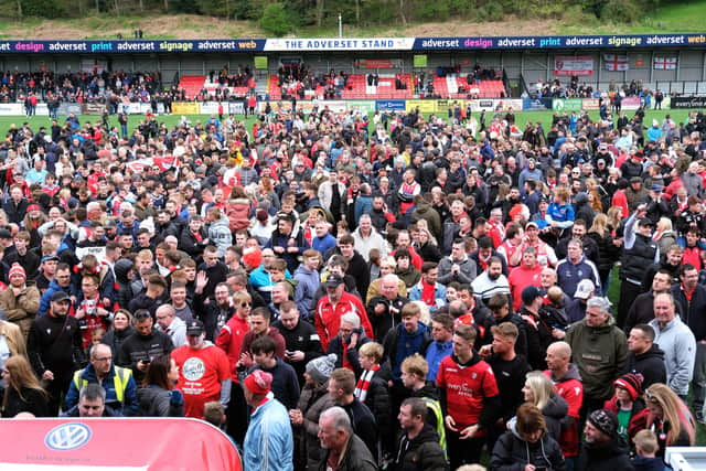 GOING UP: Scarborough fans celebrate their side's promotion to National League North after a play-off victory over Warrington Town. Picture: Richard Ponter