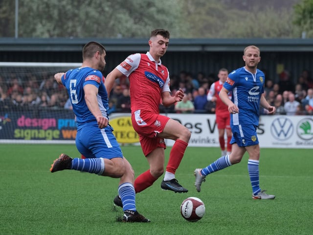 Scarborough Athletic's Luca Colville closes down Warrington Town's Evan Gumbs