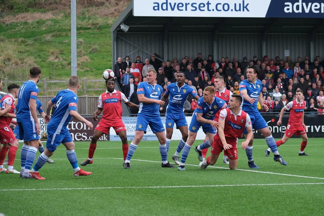 Scarborough Athletic defender Will Thornton gets on the end of a corner against Warrington Town