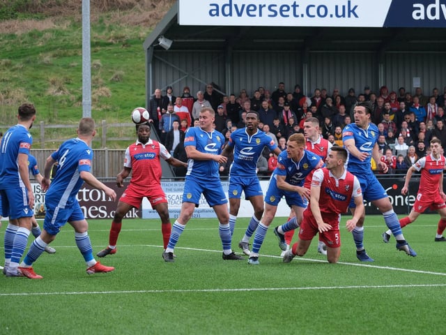 Scarborough Athletic defender Will Thornton gets on the end of a corner against Warrington Town