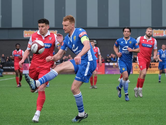 Skippers Michael Coulson, of Scarborough Athletic, left, and Mark Roberts (Warrington Town) battle it out