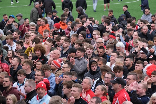 The jubilant Scarborough Athletic fans watch the trophy presentation after the final whistle