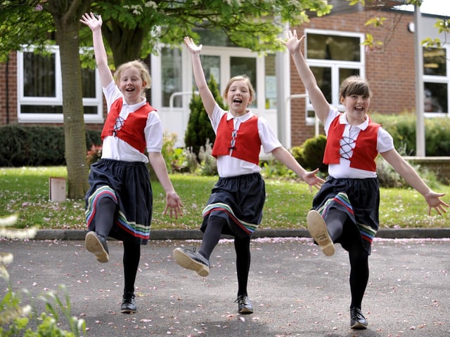 The Cayton Cloggies keep a Yorkshire tradition alive in the village, as Jay Durkin left, Leanne Cameron and Megan Elvidge learn the skill of clog dancing at an after-school club at Cayton Primary School.