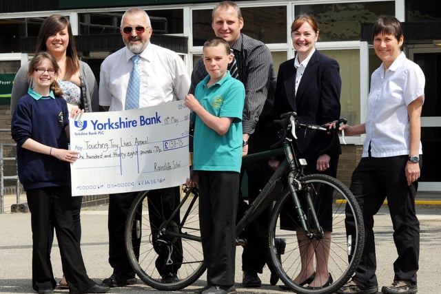 Pictured with their cheque for the Touching Tiny Lives appeal are Raincliffe pupils, front, left to right, Tori Rhind and Matthew Warnes, with, back, from left, Sarah Roberts, Steve Roberts, Gareth Lewis, Lesley Hall from Chamber of Commerce, and Karen Clark from Thornton le Dale Primary School.