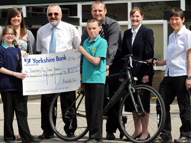 Pictured with their cheque for the Touching Tiny Lives appeal are Raincliffe pupils, front, left to right, Tori Rhind and Matthew Warnes, with, back, from left, Sarah Roberts, Steve Roberts, Gareth Lewis, Lesley Hall from Chamber of Commerce, and Karen Clark from Thornton le Dale Primary School.