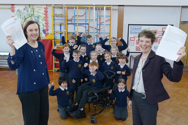 Our Lady and St Peter’s School pupils celebrate an outstanding Ofsted report in 2015. Pictured with the pupils from different year groups are head teachers Angela Spence and Anne Parr. Photo by Paul Atkinson (NBFP pa1510-1c)