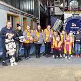The fundraiser arrive at Scarborough lifeboat station and donate their money.